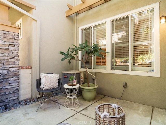 view of patio with central AC unit