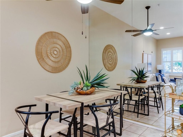 dining space with light tile patterned floors and ceiling fan