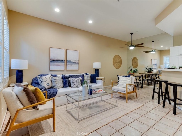 tiled living room featuring ceiling fan