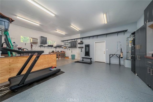 interior space with a workshop area and a wall mounted air conditioner