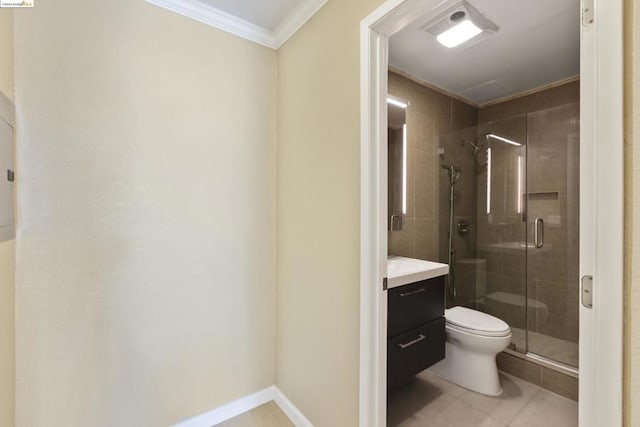 bathroom with vanity, crown molding, tile patterned flooring, toilet, and walk in shower