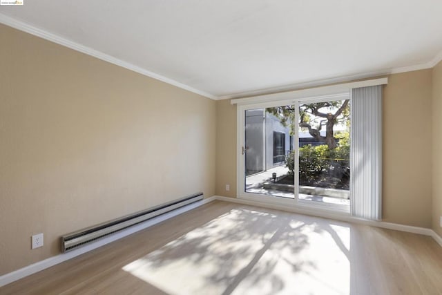 empty room featuring hardwood / wood-style floors, crown molding, and a baseboard radiator