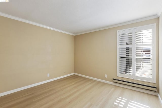 unfurnished room featuring light hardwood / wood-style flooring, baseboard heating, and ornamental molding