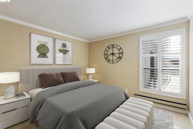 bedroom featuring baseboard heating and ornamental molding