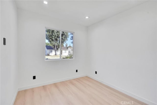 unfurnished room featuring light hardwood / wood-style floors