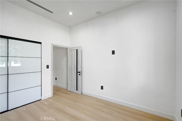 unfurnished bedroom with light hardwood / wood-style floors