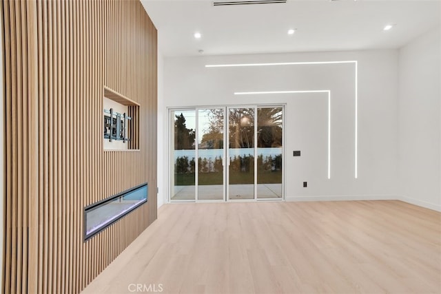 unfurnished living room with light wood-type flooring