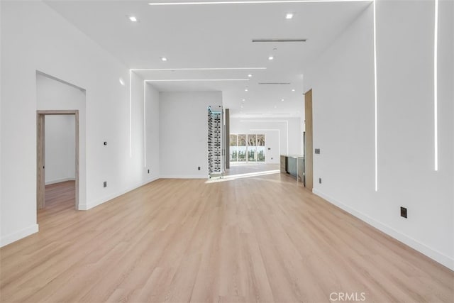 unfurnished living room with light wood-type flooring