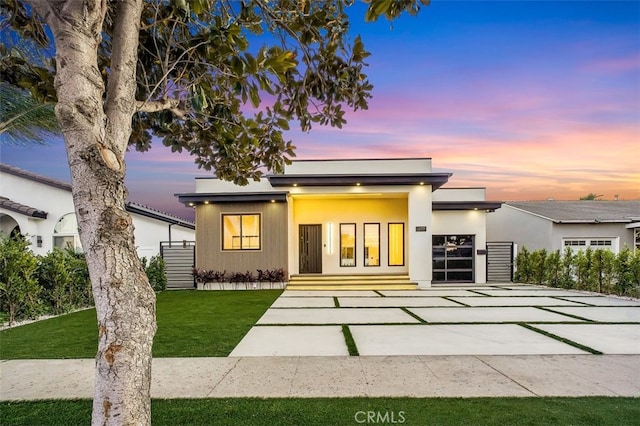 contemporary house with a lawn