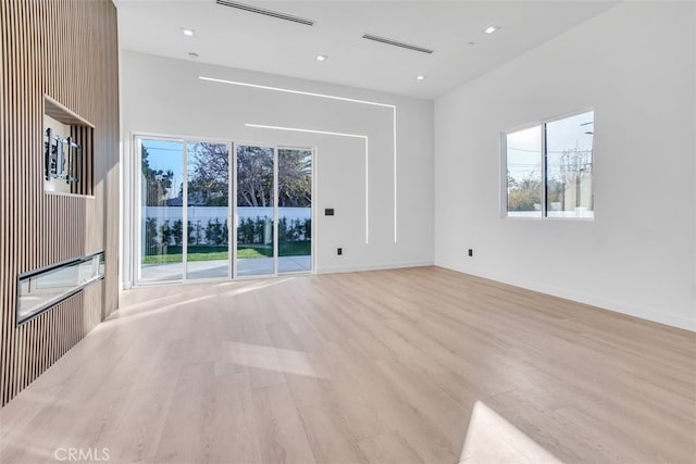 unfurnished living room featuring light hardwood / wood-style floors