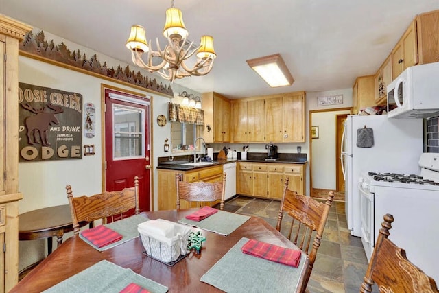 kitchen featuring light brown cabinets, sink, a notable chandelier, pendant lighting, and white appliances