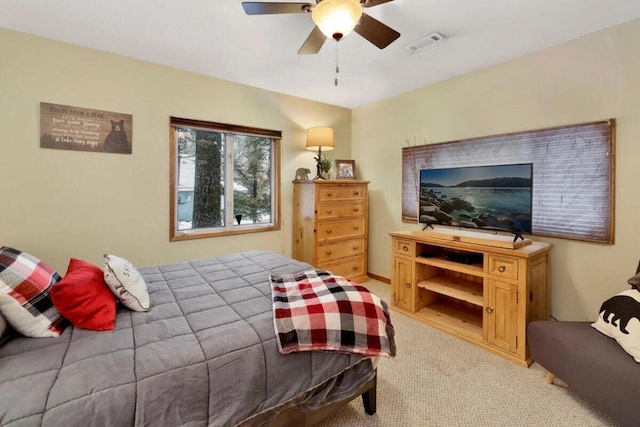 bedroom featuring ceiling fan and light colored carpet