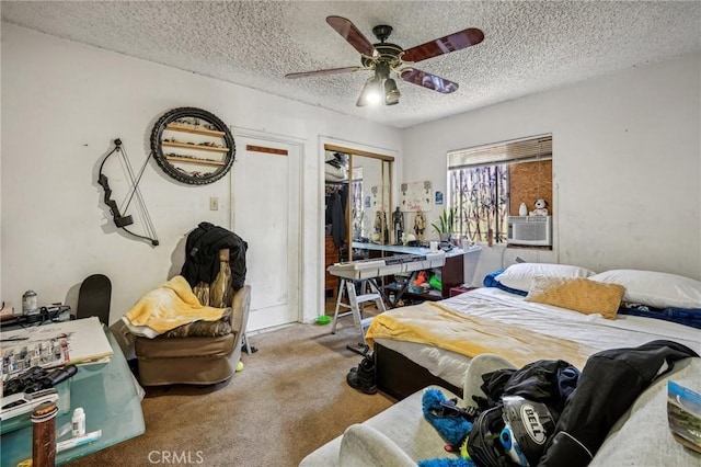 bedroom with ceiling fan, carpet floors, a textured ceiling, and a closet