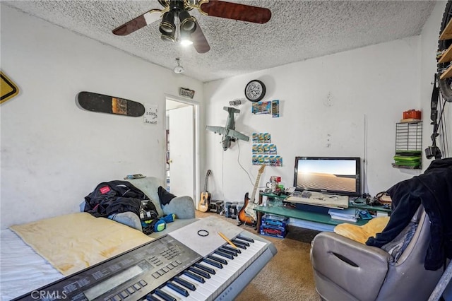 interior space with ceiling fan and a textured ceiling