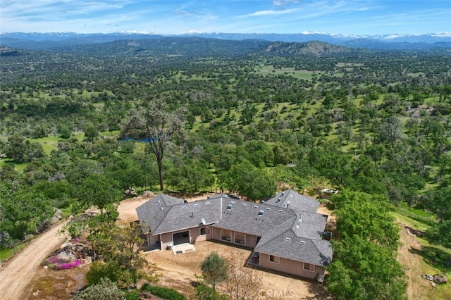 birds eye view of property featuring a mountain view