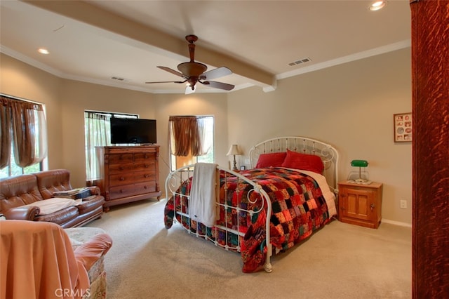 bedroom featuring multiple windows, ceiling fan, and light colored carpet