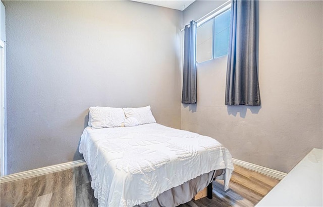 bedroom featuring dark wood-type flooring