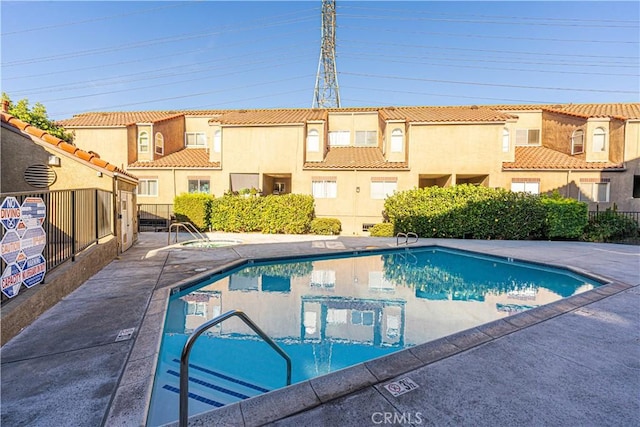 view of swimming pool with a patio