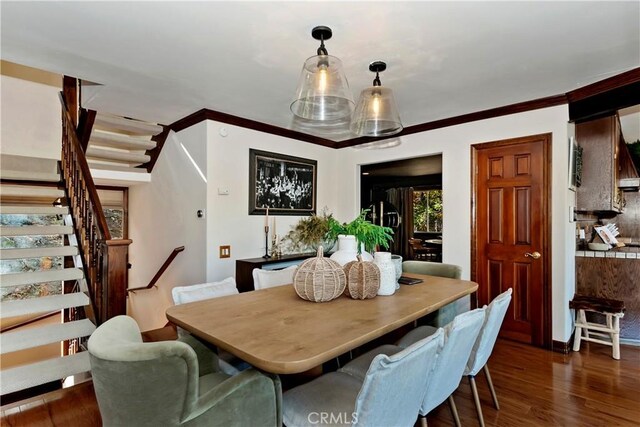 27538 W Shore Rd, Lake Arrowhead, CA 92352 - dining room featuring stairway, dark wood finished floors, and ornamental molding