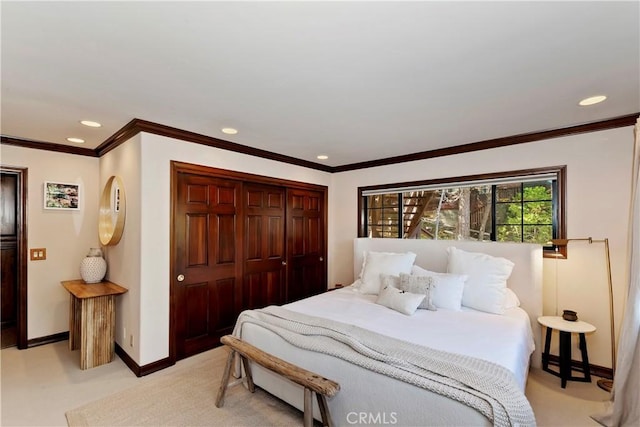 27538 W Shore Rd, Lake Arrowhead, CA 92352 - bedroom featuring a closet, baseboards, recessed lighting, light carpet, and crown molding