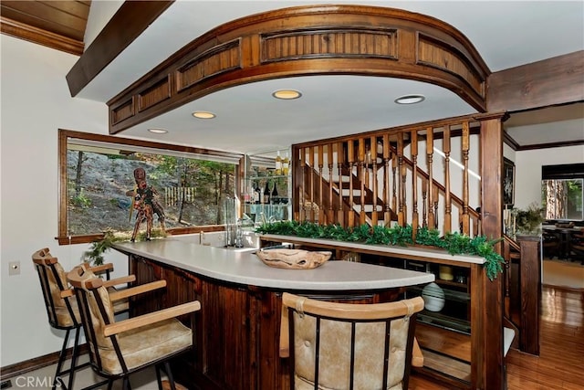 27538 W Shore Rd, Lake Arrowhead, CA 92352 - indoor wet bar featuring wood finished floors, crown molding, stairway, and recessed lighting