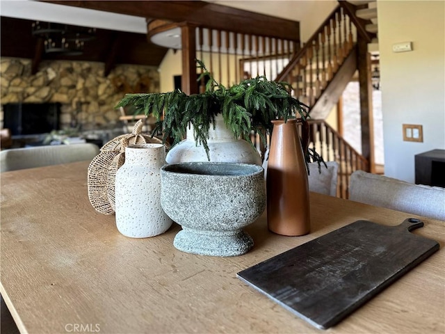 dining room featuring a stone fireplace