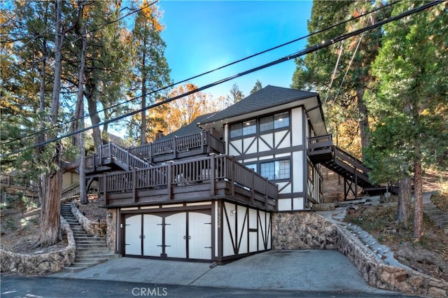 27538 W Shore Rd, Lake Arrowhead, CA 92352 - back of house with stairs, a wooden deck, and a shingled roof