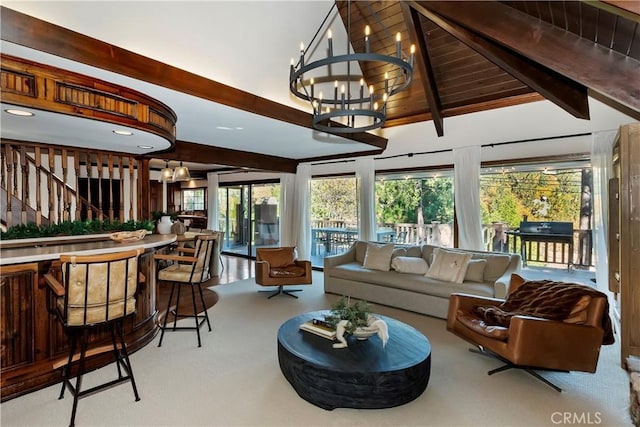 sunroom with an inviting chandelier, wooden ceiling, and lofted ceiling with beams