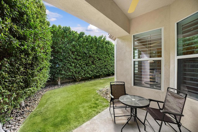 view of patio featuring ceiling fan