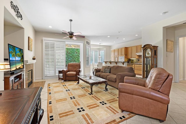 living room featuring ceiling fan and light tile patterned floors