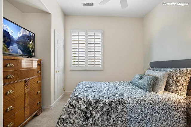 carpeted bedroom with ceiling fan