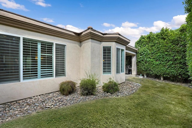 view of property exterior featuring a yard