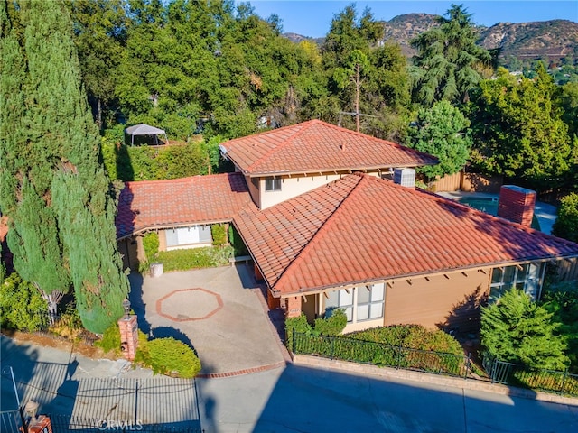 birds eye view of property with a mountain view