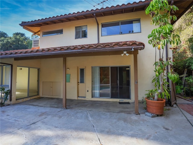 rear view of house with a patio