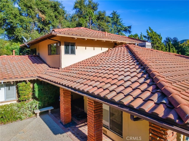 view of property exterior featuring a patio