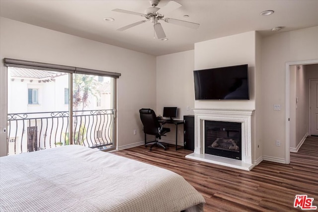 bedroom featuring access to exterior, dark hardwood / wood-style floors, and ceiling fan