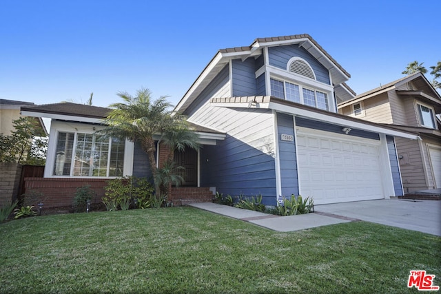 front of property with a garage and a front lawn