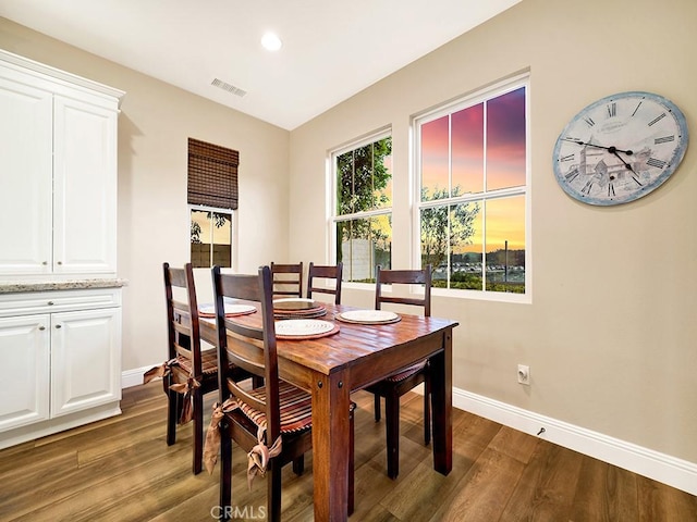 dining area featuring dark hardwood / wood-style flooring