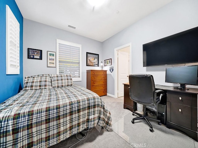 bedroom featuring light colored carpet