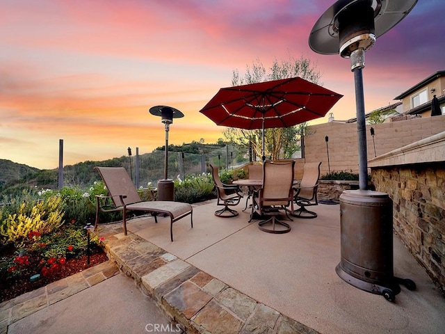 view of patio terrace at dusk