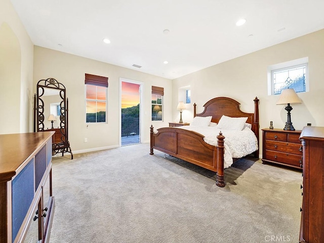 carpeted bedroom featuring access to exterior