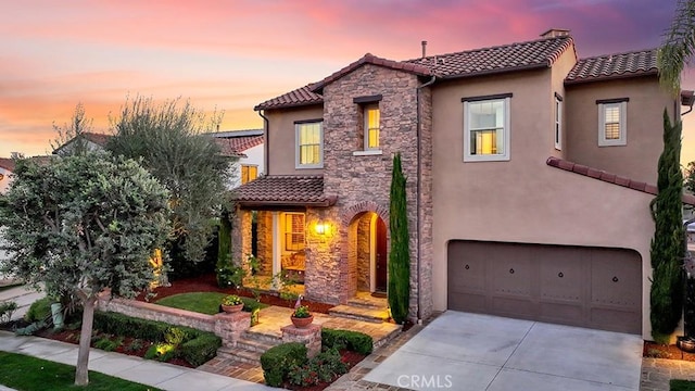 mediterranean / spanish-style house featuring a garage