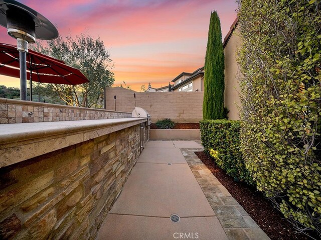 view of patio terrace at dusk