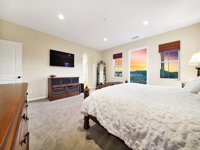 carpeted bedroom featuring access to outside