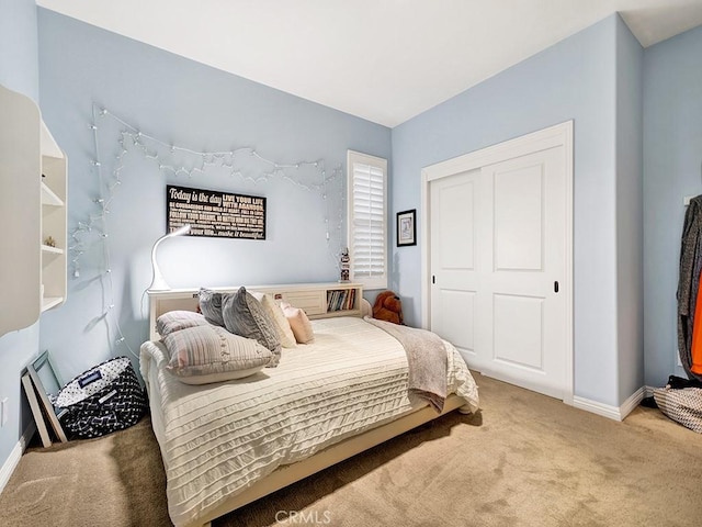 bedroom with a closet and carpet flooring