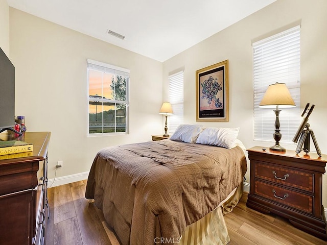 bedroom with light hardwood / wood-style flooring