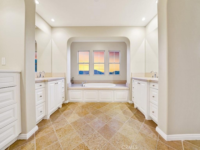 bathroom with vanity and a bathtub