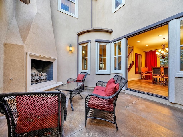 view of patio / terrace featuring an outdoor living space with a fireplace