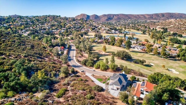 birds eye view of property with a mountain view