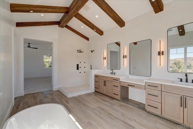 bathroom featuring vanity, plus walk in shower, lofted ceiling with beams, hardwood / wood-style flooring, and ceiling fan